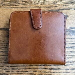 Vintage brown leather coach wallet with snap closure